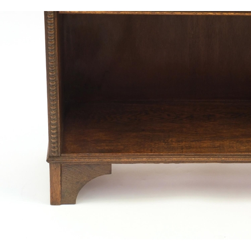 42 - Oak open book case fitted with two adjustable shelves, 97cm H x 78cm W x 25cm D