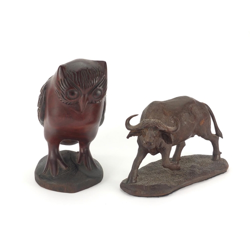 348 - Carved wooden buffalo together with an owl, the buffalo signed D Gwebu, the largest 28cm H