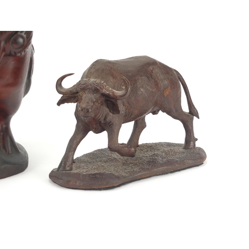 348 - Carved wooden buffalo together with an owl, the buffalo signed D Gwebu, the largest 28cm H