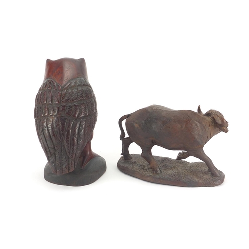 348 - Carved wooden buffalo together with an owl, the buffalo signed D Gwebu, the largest 28cm H