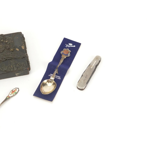 320 - Miscellaneous items including a silver flanked folding knife and silver and enamelled spoons