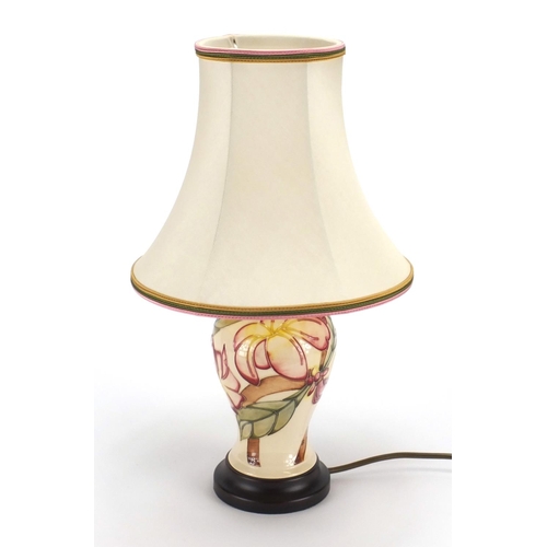 2110 - Moorcroft Frangipani pattern lamp base with silk lined shade, 40cm high