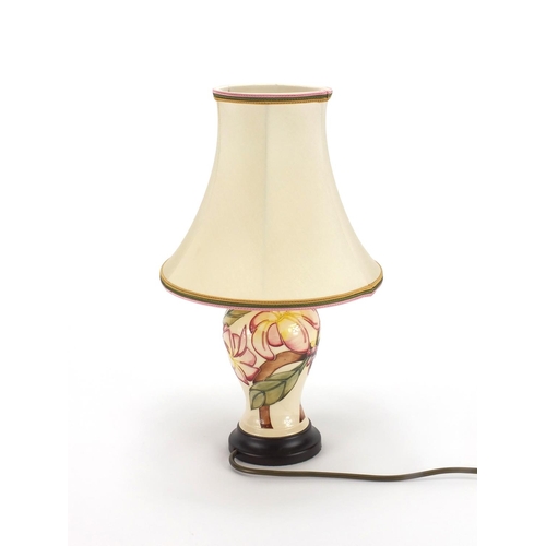 2110 - Moorcroft Frangipani pattern lamp base with silk lined shade, 40cm high