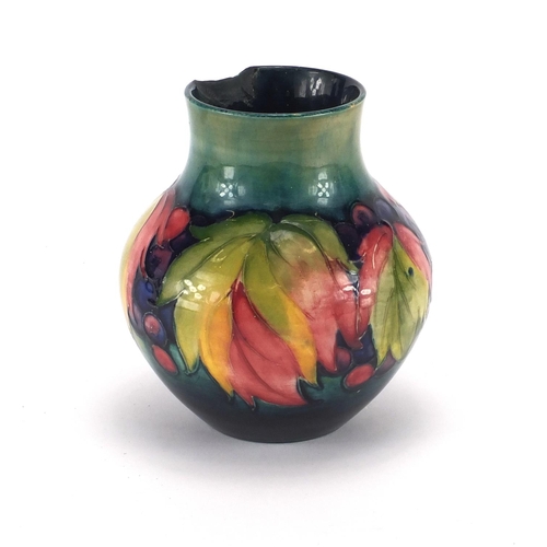 2106 - Moorcroft leaf and berry pattern vase, factory marks to the base, 13.5cm high