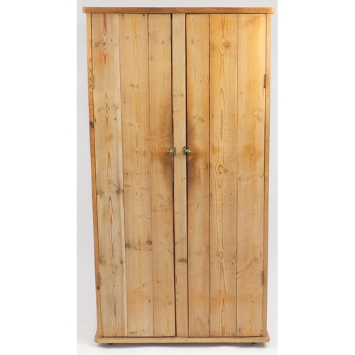 102 - Rustic pine two door hall cupboard enclosing four shelves, 169cm H x 89cm W x 53cm D