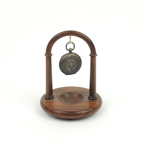 243 - Silver ladies pocket watch with ornate dial, with a rosewood watch stand