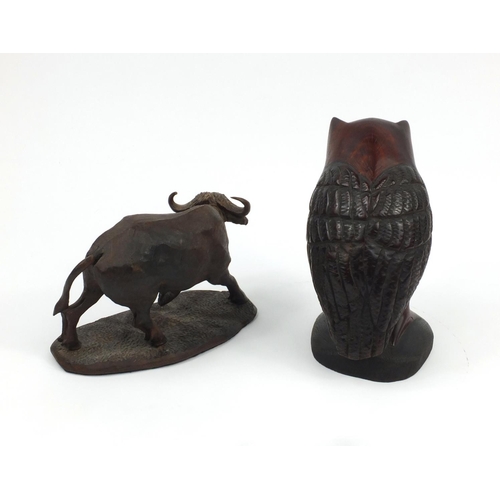 348 - Carved wooden buffalo together with an owl, the buffalo signed D Gwebu, the largest 28cm H