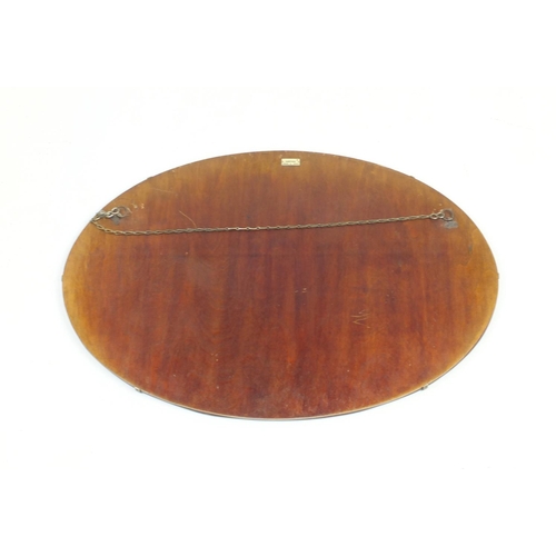 116 - Edwardian inlaid mahogany oval mirror with bevelled plate and one other oval bevelled edge mirror, t... 