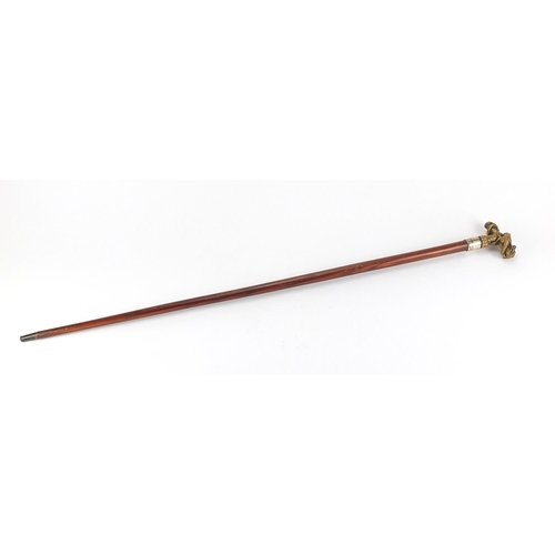 161 - Exotic wood walking cane with silver collar and brass dragon handle, 84cm L