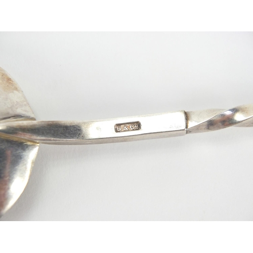 266 - Pair of silver plated apostle spoons with figural terminals, housed in a velvet lined leather case