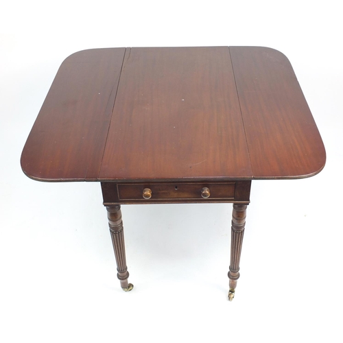 37 - Victorian mahogany Pembroke table fitted with a drawer to either end, raised on turned reeded legs a... 