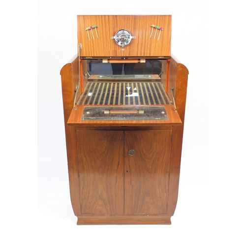 11 - Art Deco walnut cocktail cabinet fitted with a mechanical top and mirrored interior above a drawer a... 
