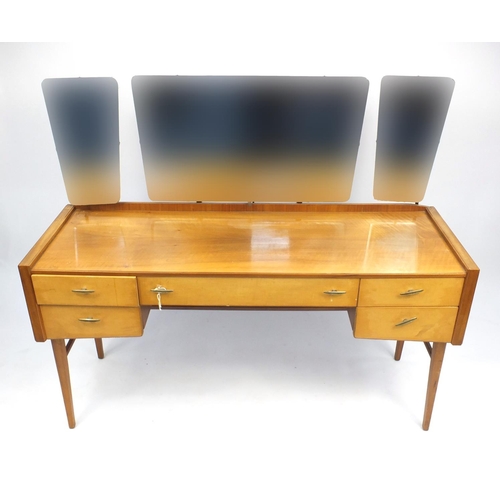 5 - Handcraft teak six drawer chest and dressing table with mirrored back, designed by Alfred Cox, the d... 