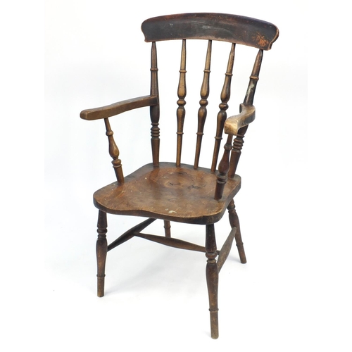 49A - Walnut spindle back elbow chair, 102cm H