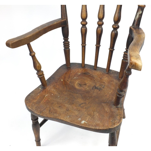 49A - Walnut spindle back elbow chair, 102cm H