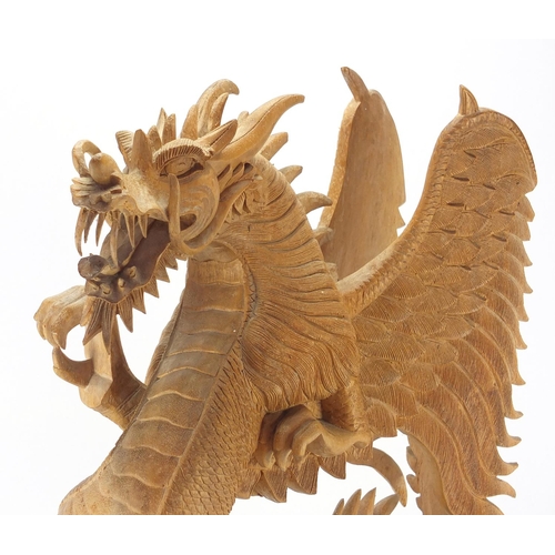 101 - Large carved wooden sculpture of a Chinese dragon, 60cm H