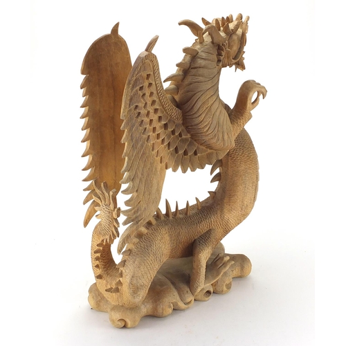 101 - Large carved wooden sculpture of a Chinese dragon, 60cm H