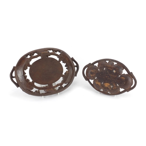 12 - Two black forest baskets, both carved with leaves and berries, the largest 36cm wide