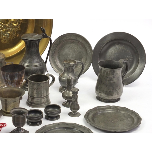 229 - Large selection of antique and later brass candle sticks, pewter plates and tankards etc