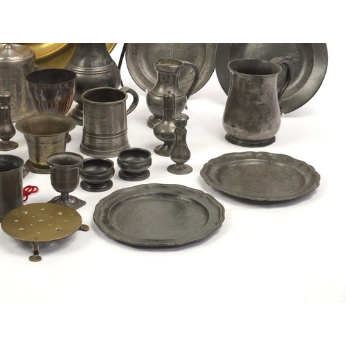 229 - Large selection of antique and later brass candle sticks, pewter plates and tankards etc