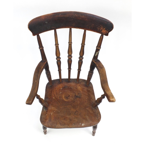 49A - Walnut spindle back elbow chair, 102cm H