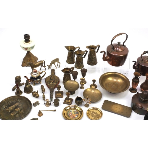 224 - Assorted metal wares including horse brasses, brass flagons, fire bellows, hand painted opaline glas... 