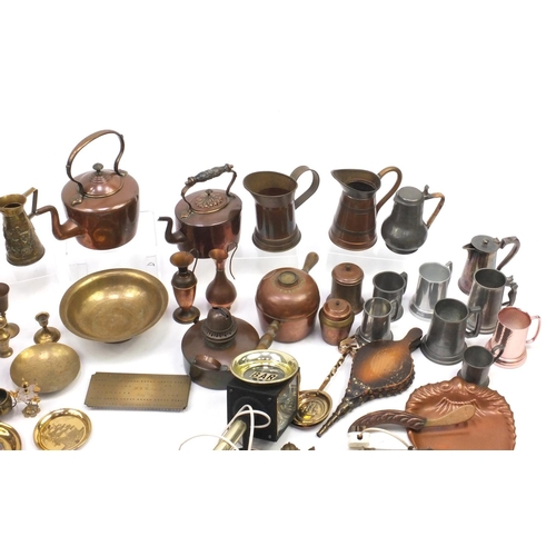 224 - Assorted metal wares including horse brasses, brass flagons, fire bellows, hand painted opaline glas... 