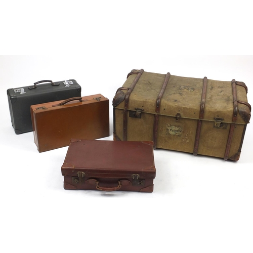 84 - Wooden bound trunk with leather carrying handle, together with three vintage case including a Globe-... 