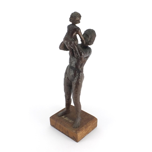 2100 - Bronze study of a nude mother and child, raised on a rectangular wooden base bearing an inscription ... 