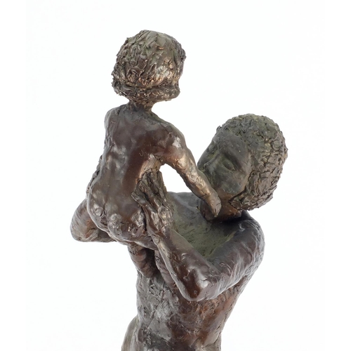 2100 - Bronze study of a nude mother and child, raised on a rectangular wooden base bearing an inscription ... 