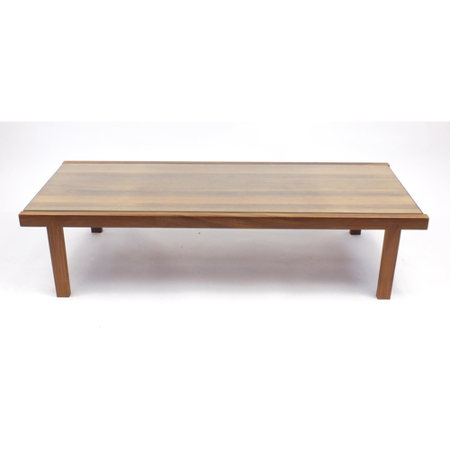 2041 - Mcintosh & Co teak coffee table with inset glass top, label to the underside, 140cm wide