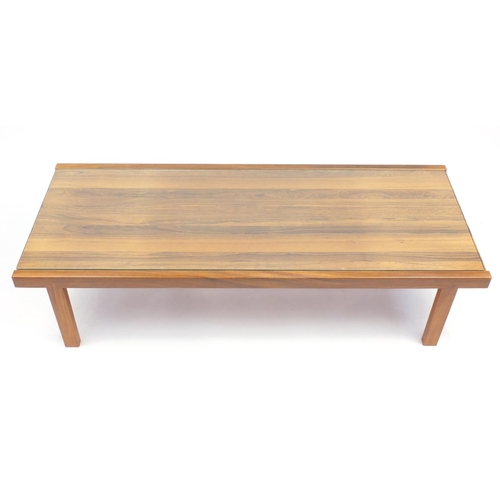 2041 - Mcintosh & Co teak coffee table with inset glass top, label to the underside, 140cm wide