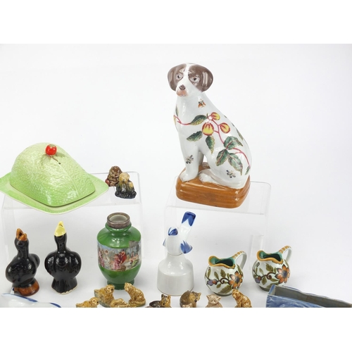 403 - Collectable china including Wade Whimsies, Gouda miniature jugs, Oriental dogs etc