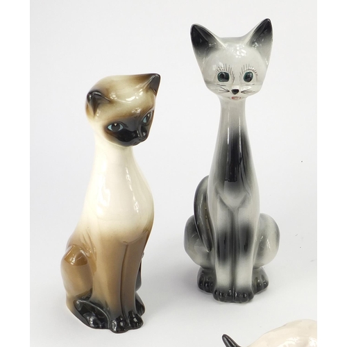 402 - Group of china cats including a large signed Winstanley example