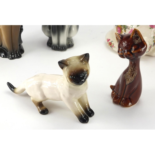 402 - Group of china cats including a large signed Winstanley example