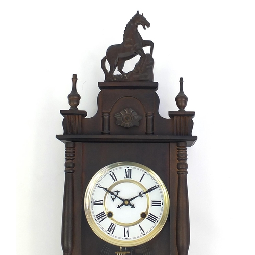 130 - Mahogany wall hanging clock with visible pendulum, 80cm L