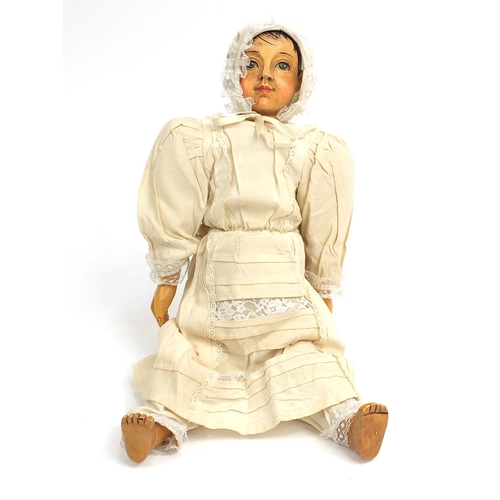 401 - Large Victorian style wooden child's doll, 53cm L