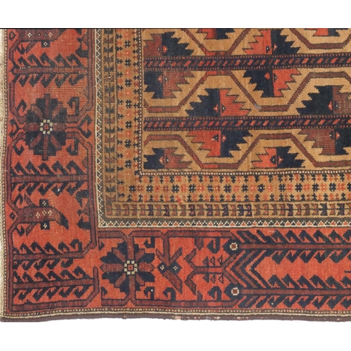 6 - Middle Eastern rug decorated with a brown and geometric blue pattern in the floral boarder, approxim... 