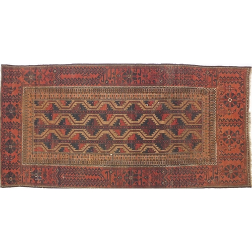 6 - Middle Eastern rug decorated with a brown and geometric blue pattern in the floral boarder, approxim... 