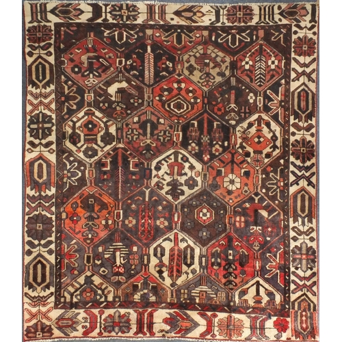 18 - Rectangular Persian Azarbaijan rug, the central field and borders having all over floral motifs onto... 