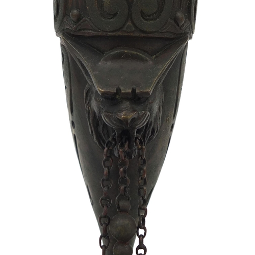 303 - Victorian bronze oil lamp with masks and lion paw feet, 25cm high