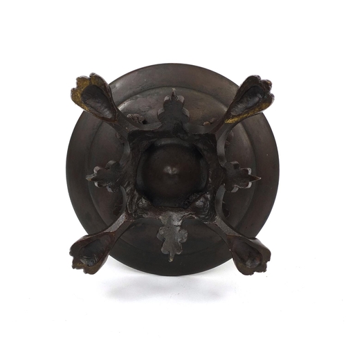 303 - Victorian bronze oil lamp with masks and lion paw feet, 25cm high