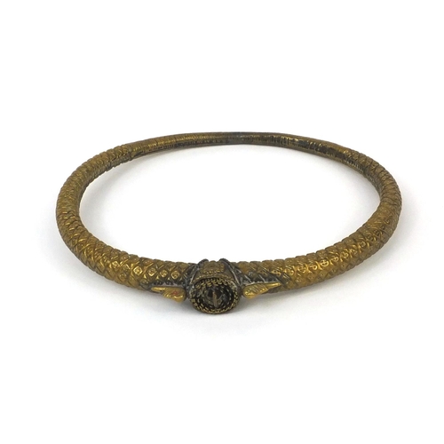 331 - Middle Eastern brass torc, 19.5cm in length