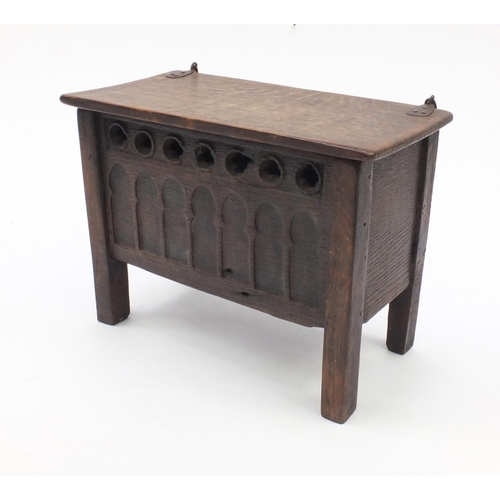 51 - Antique oak plank coffer of small proportions with hinged lid, the front panel with gothic arches, 3... 