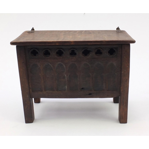 51 - Antique oak plank coffer of small proportions with hinged lid, the front panel with gothic arches, 3... 