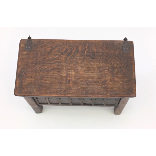 51 - Antique oak plank coffer of small proportions with hinged lid, the front panel with gothic arches, 3... 