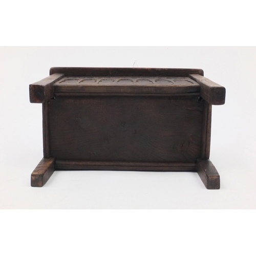 51 - Antique oak plank coffer of small proportions with hinged lid, the front panel with gothic arches, 3... 