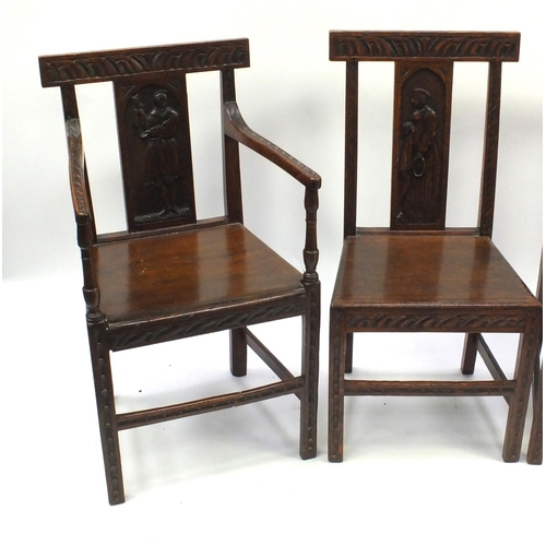 62 - Four Victorian oak chairs to include a carver, the slats carved with figures, each 92cm high