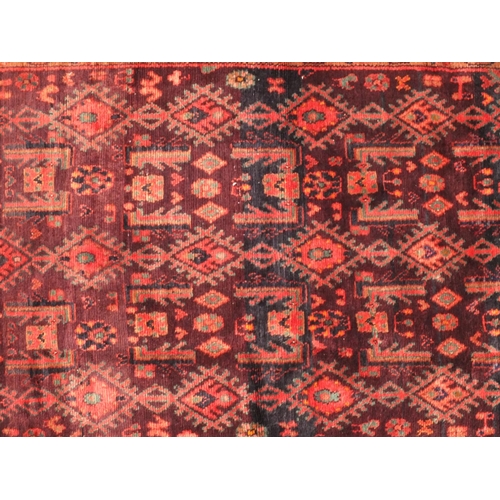 75 - Rectangular Persian Hamadan rug, the central field having all over floral motifs, onto an red and pu... 