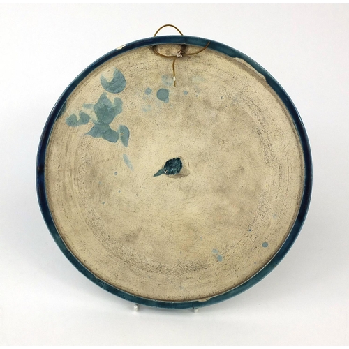 391 - Circular blue glazed pottery wall plaque, after Bertel Thorvaldsen Four Seasons, 26cm in diameter